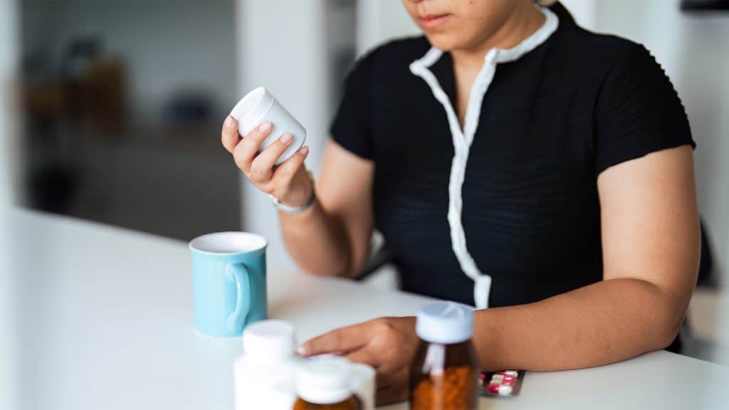 Woman Reviewing Prescriptions